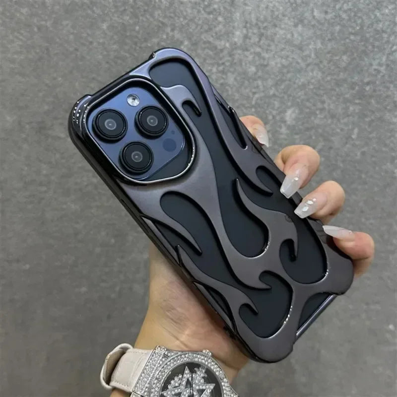 Hand holding a phone with a black flame-patterned case against a gray background