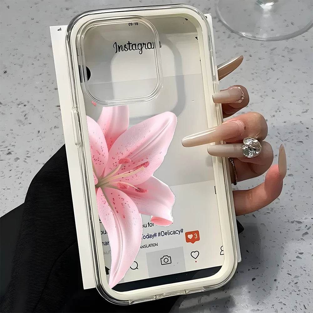 Phone case with pink flower design held by a hand on a gray surface
