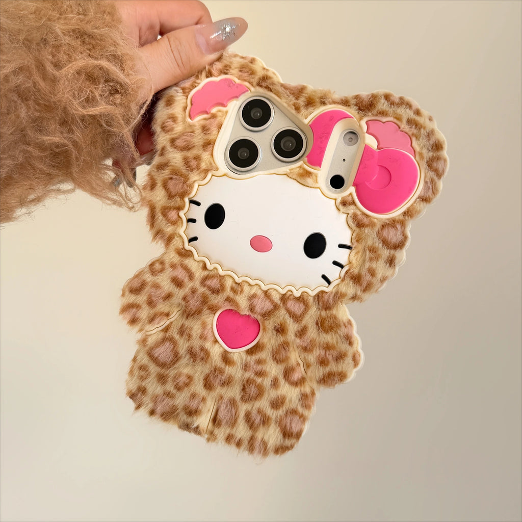 Phone case with leopard print and Hello Kitty design held by a person.