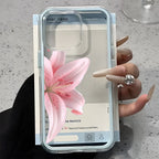 Phone case with pink flower design held by a hand on a light gray surface