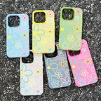 Set of colorful floral phone cases on a textured surface