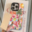 Phone case with tropical design held over a book