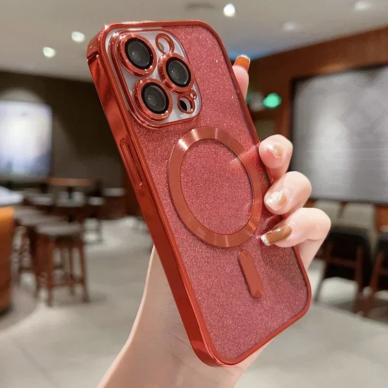 Red glittery phone case with a ring holder held by a hand in an indoor setting.