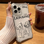 A hand holding a clear phone case featuring 'The Lion King' character artwork and the Disney logo, shown over a wooden table next to an iced coffee.