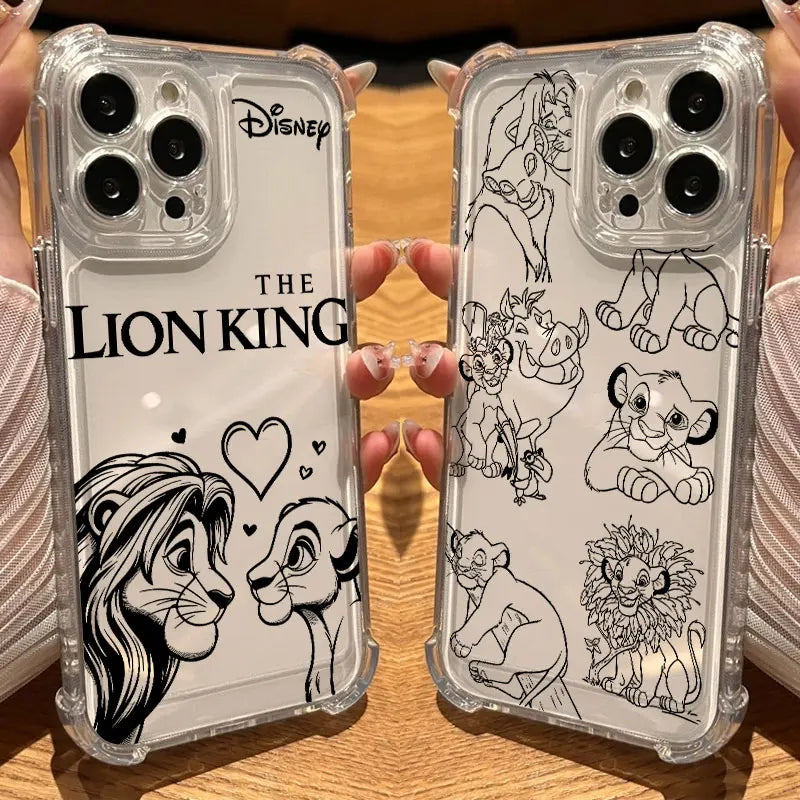 Two clear phone cases held in hands over a wooden surface. One case has black line art of Simba and Nala with 'THE LION KING' text and Disney logo, and the other has multiple Lion King character line drawings.