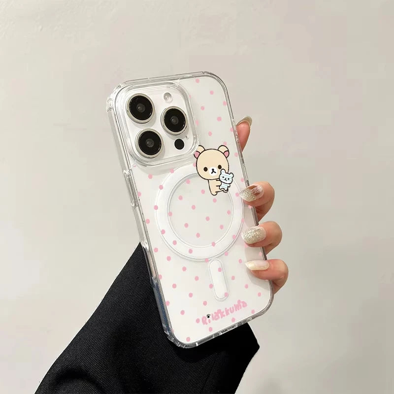 Clear phone case with cartoon character and pink polka dots held by a hand against a neutral background