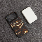 Phone case with marble pattern on a textured surface