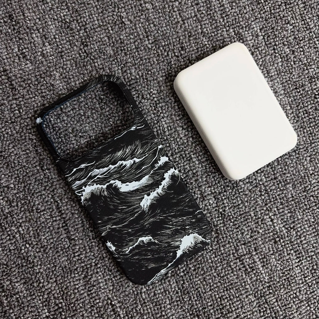Phone case with wave design and white square object on gray surface