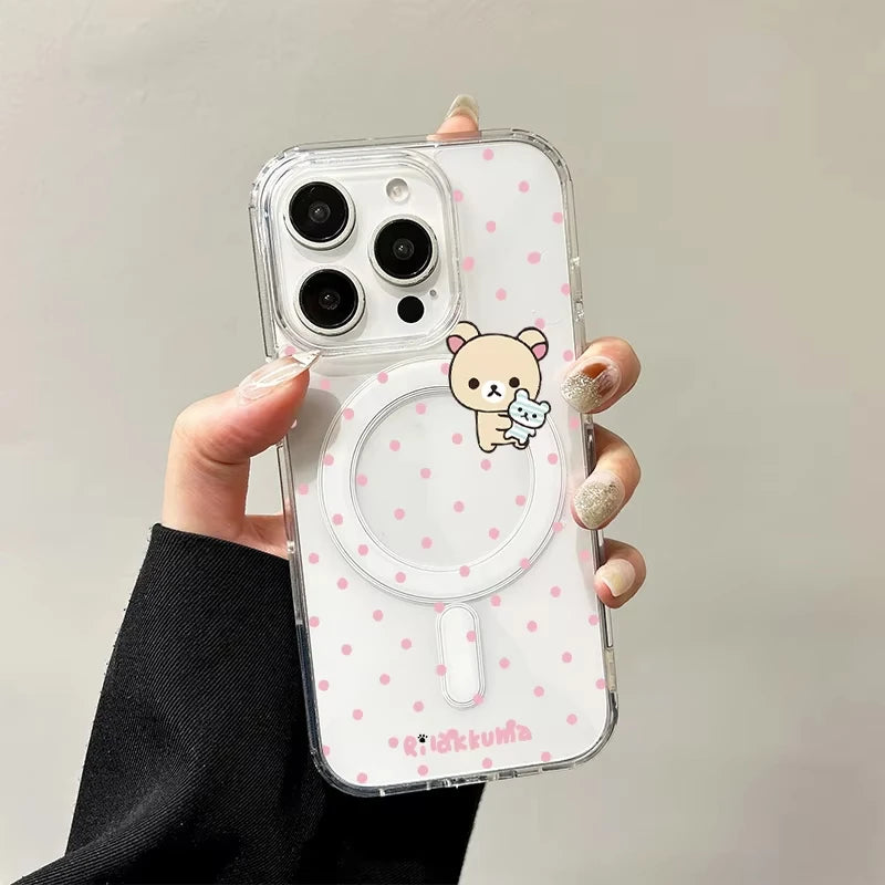 Phone case with a bear design and pink polka dots held by a hand against a neutral background