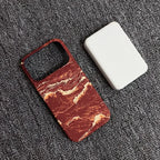 Phone case with marble pattern on a textured surface