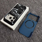 Phone case with marble design on phone and blue mesh bag on gray surface