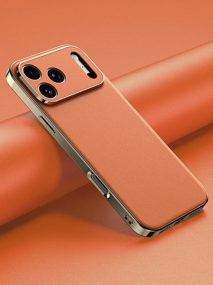 Smartphone with a gold case on an orange background