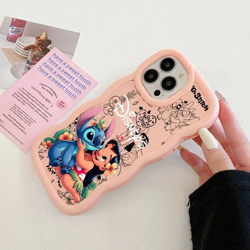 A pink phone case featuring Disney's Lilo and Stitch, held by a hand. The case has black line art illustrations of Mickey and Minnie Mouse, a Disney logo, and 'LOST' text, and is photographed on a white surface next to a decorative card.