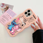 A pink phone case with cartoon character prints, held by a hand. The case features Stitch, Angel, and Disney-themed doodles.