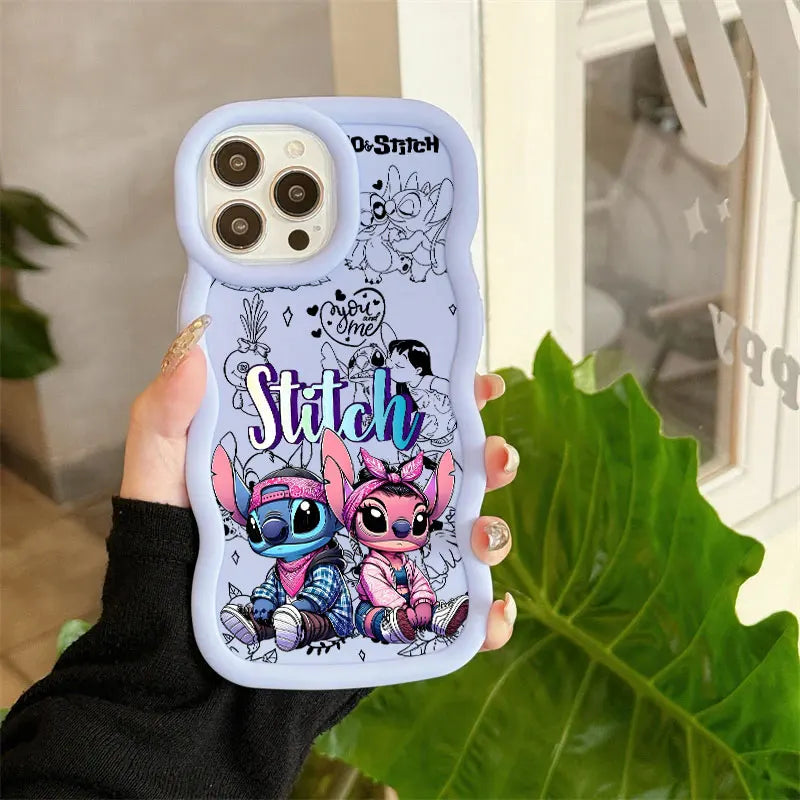 A hand holding a light blue phone case featuring cartoon Stitch and Angel illustrations, with the word 'Stitch' in large stylized text and black line-art drawings on the back.