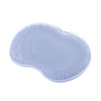 silicone foot scrubber in light blue designed with suction cups for secure shower floor grip