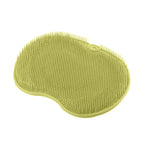 silicone foot scrubber in green color for exfoliating feet and stimulating circulation in shower