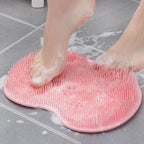 silicone foot scrubber placed on shower floor for easy non-slip foot cleaning and massaging