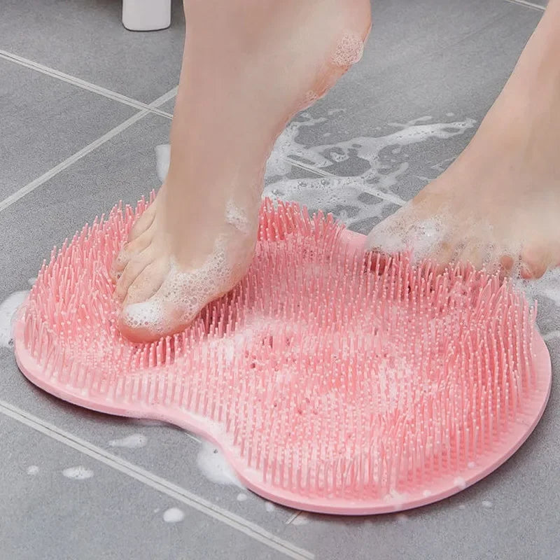 silicone foot scrubber placed on shower floor for easy non-slip foot cleaning and massaging
