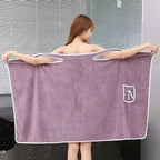 wearable bath towel spread open wide by model in purple fast drying spa robe wrap