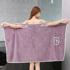 wearable bath towel held open by woman in purple fast dry microfibre shower wrap robe