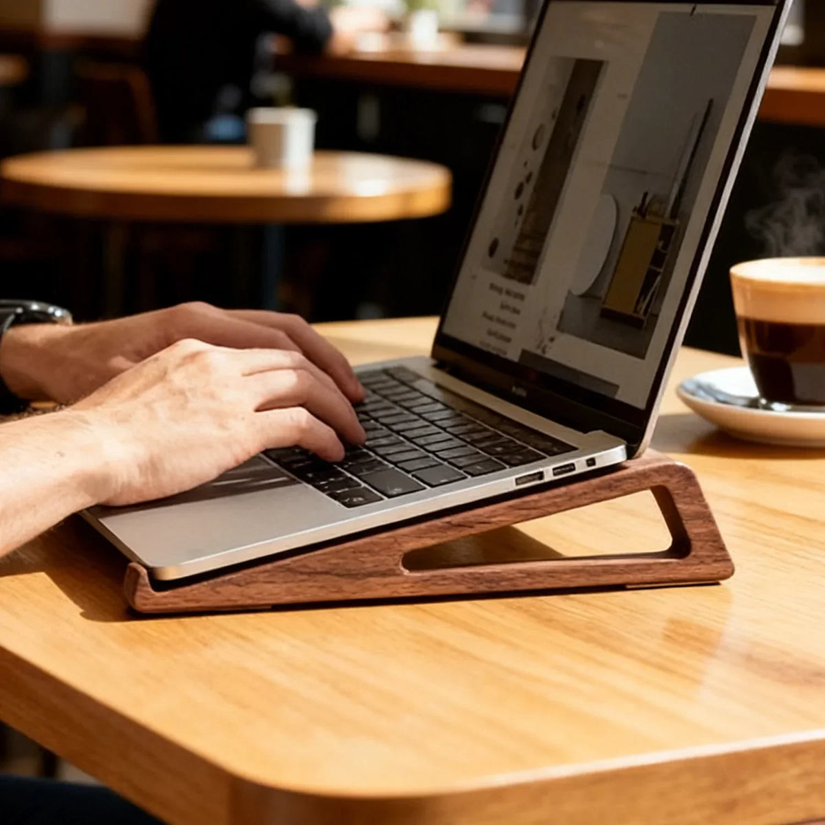 Wooden Laptop Stand supporting laptop during work for comfortable typing angle and wrist support